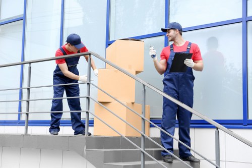 Professional moving crew loading belongings into a removal van