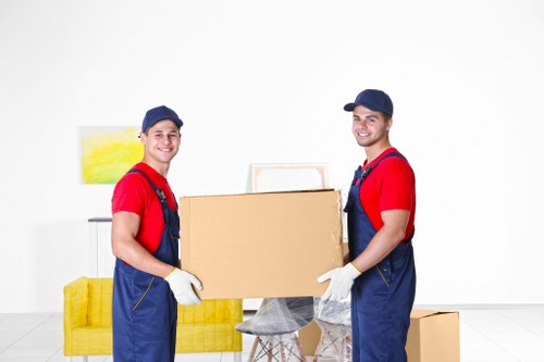 Workers using proper manual handling techniques during a removal
