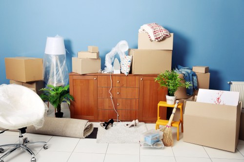 Furniture pickup team handling bulky items in a Tufnell Park home