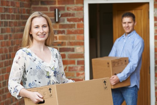 Removal team loading boxes during a house move