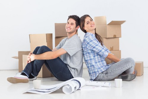 Local moving team organizing boxes in a North London property